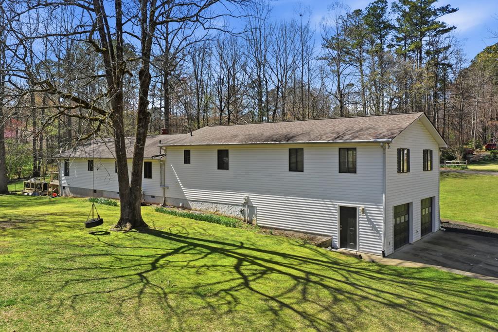 94 Brer Rabbit Trail Jasper, GA 30143 - Photo 52 of 54 a view of a house with backyard and tree