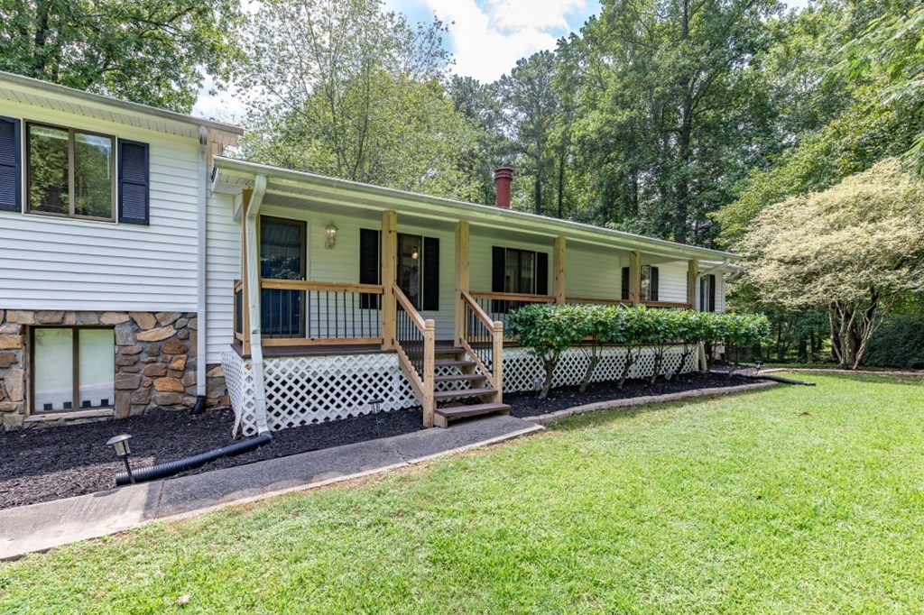 94 Brer Rabbit Trail Jasper, GA 30143 - Photo 6 of 37 a view of a house with a yard and furniture