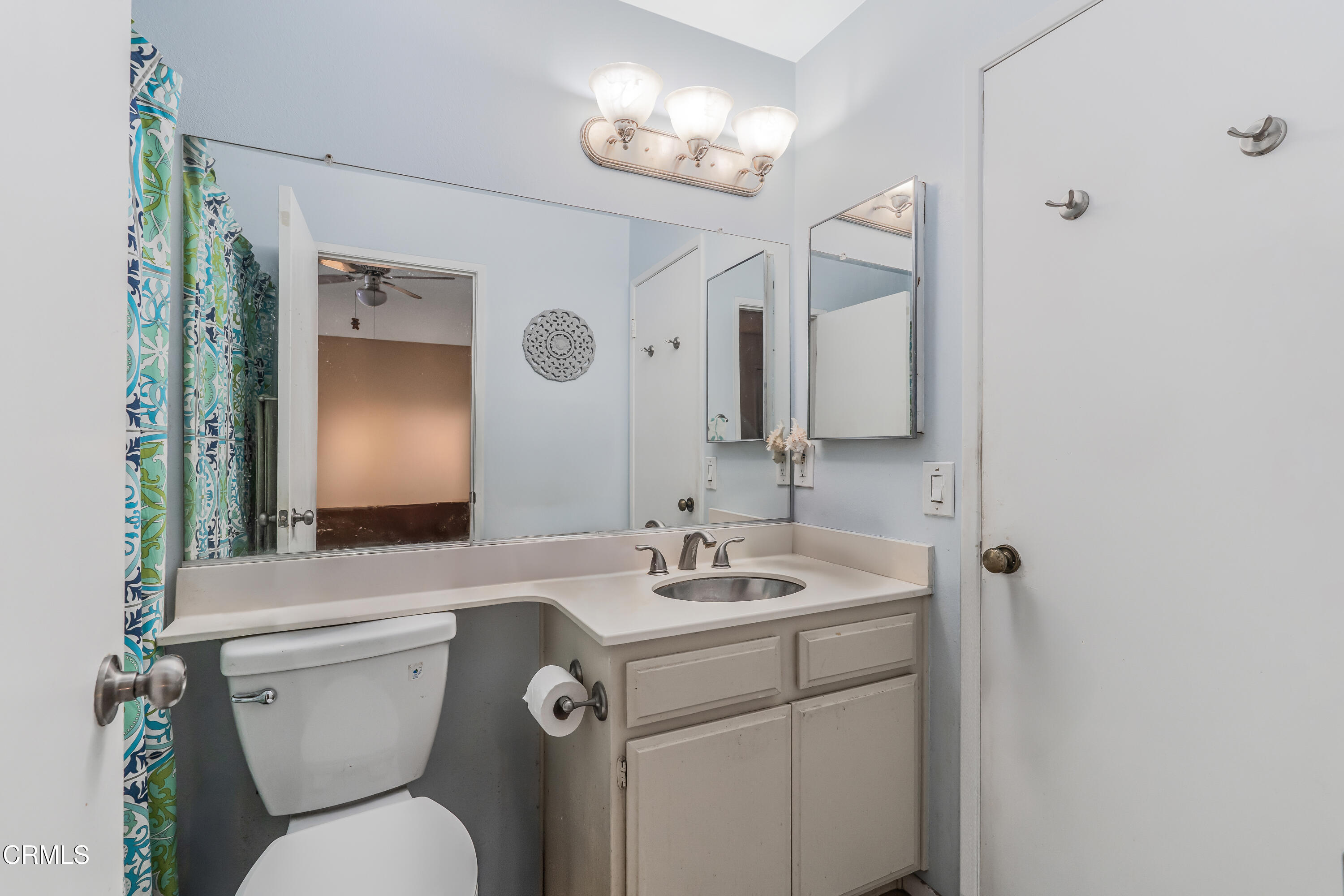 5289 Perkins Road Oxnard, CA 93033 - Photo 16 of 23 a bathroom with a toilet sink and mirror