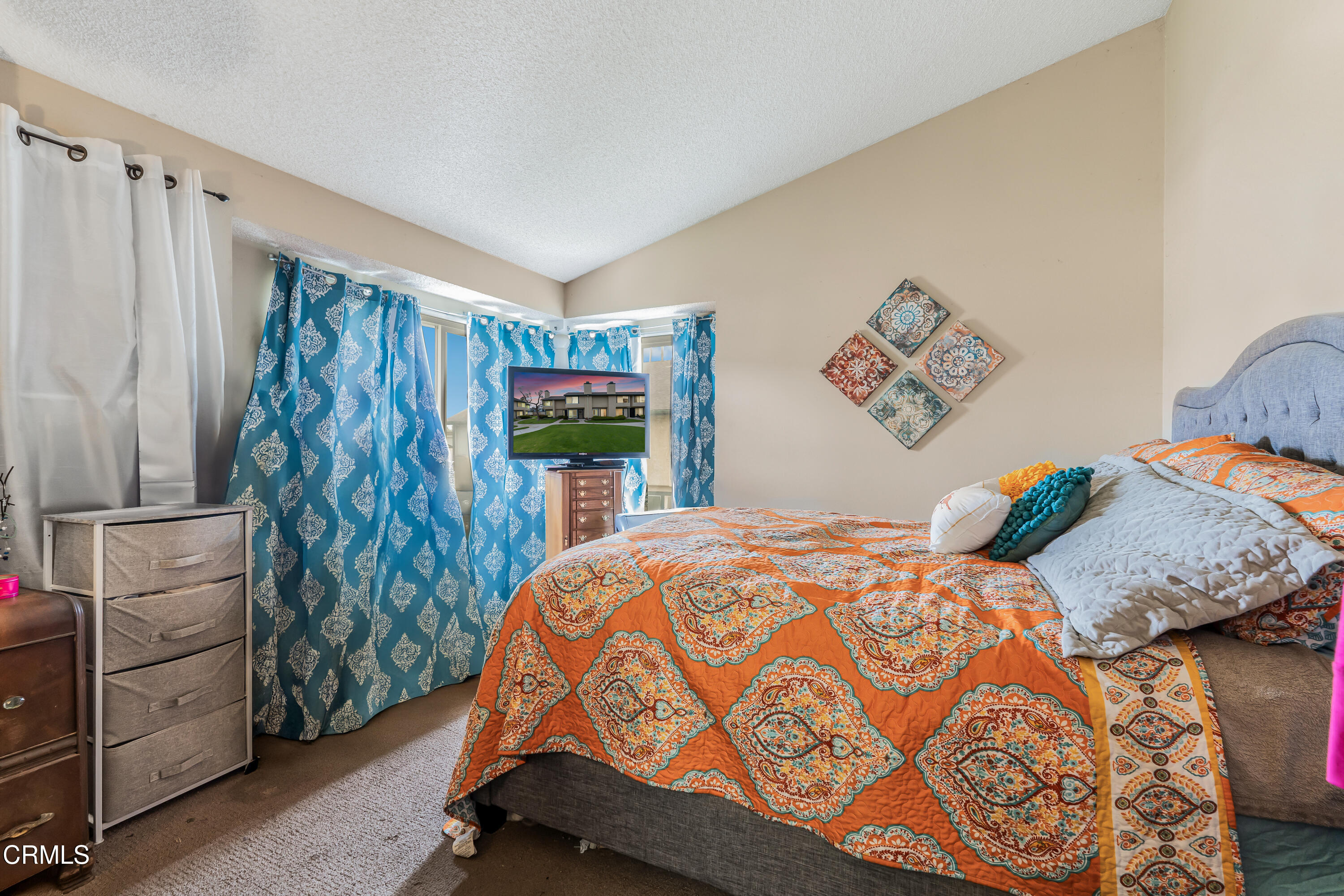 5289 Perkins Road Oxnard, CA 93033 - Photo 7 of 23 a bedroom with a bed and a cabinets