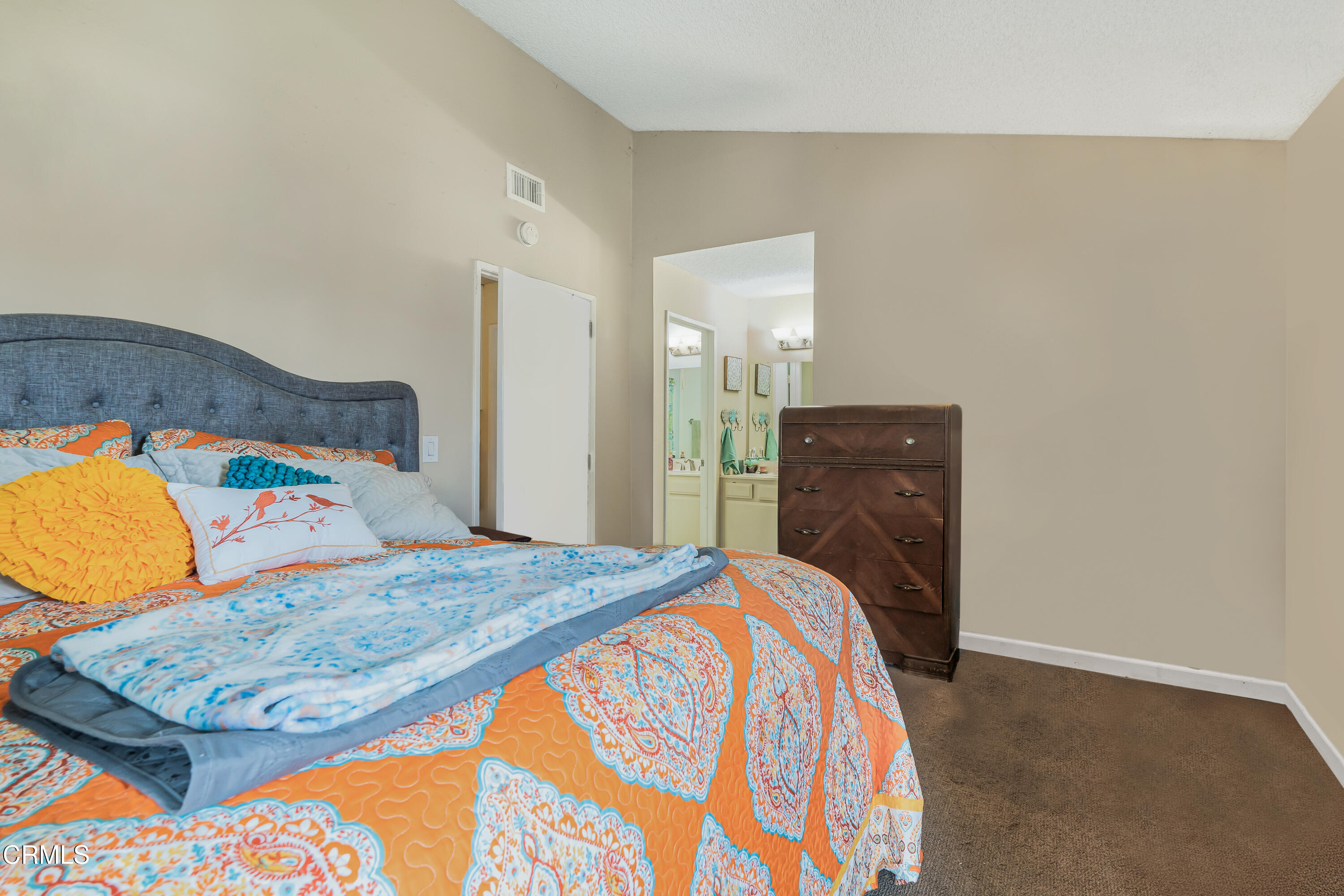 5289 Perkins Road Oxnard, CA 93033 - Photo 8 of 23 a bedroom with a bed and dresser