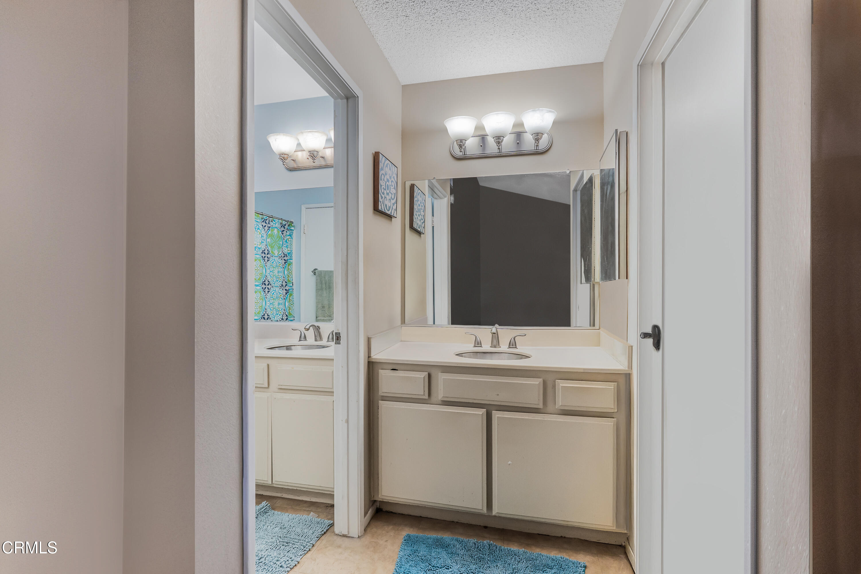 5289 Perkins Road Oxnard, CA 93033 - Photo 10 of 23 a bathroom with a sink and a mirror