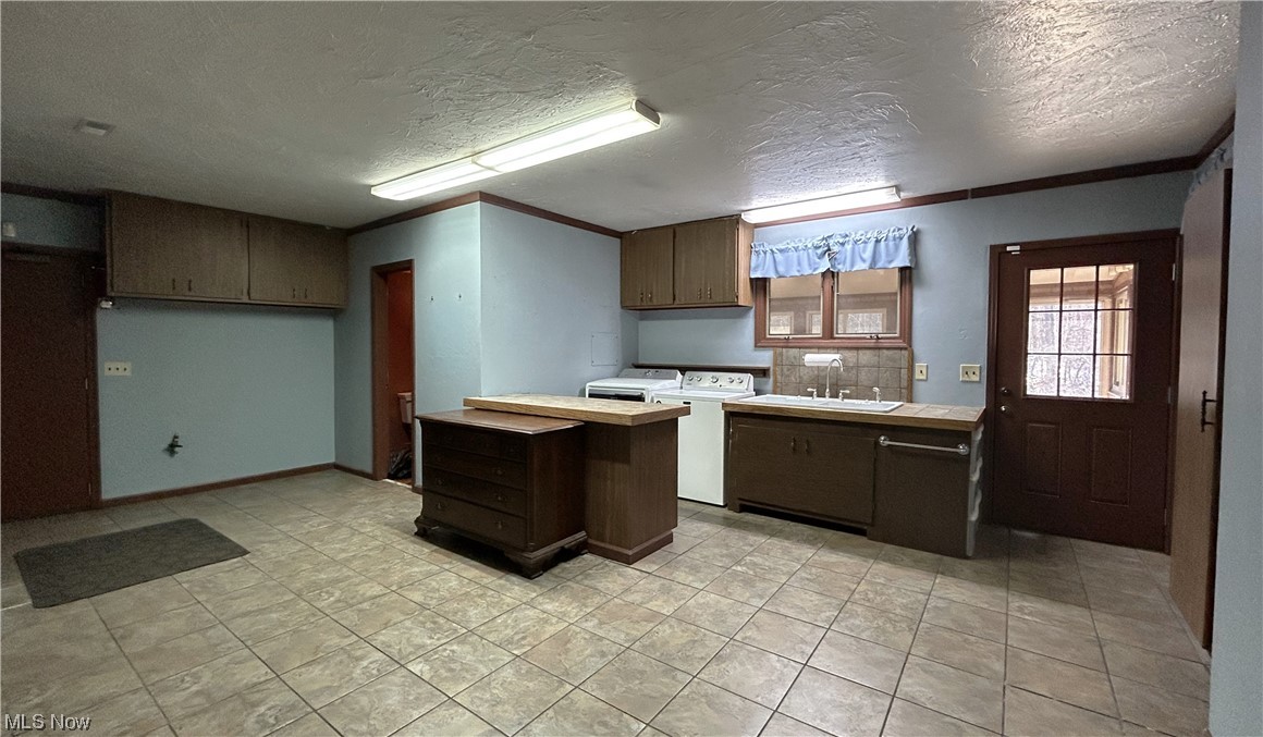 7855 Mulberry Road Chesterland, OH 44026 - Photo 23 of 46 Laundry Room opens to the Sun Room and has a full bathroom.