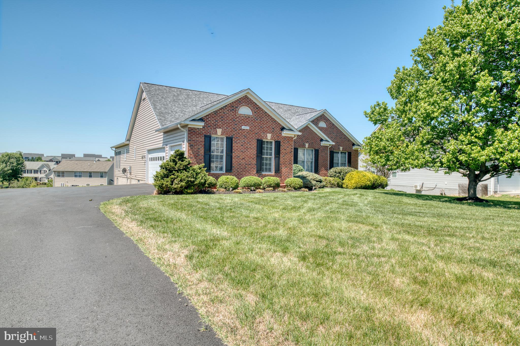 14308 South Hall Court Culpeper, VA 22701 - Photo 50 of 78 a front view of a house with a garden and trees