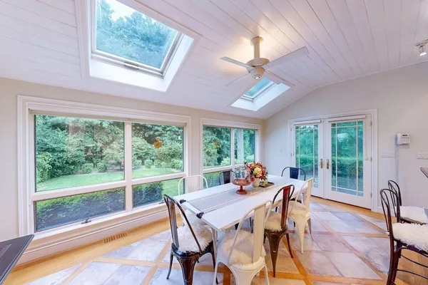 a view of a dining room with furniture window and outside view