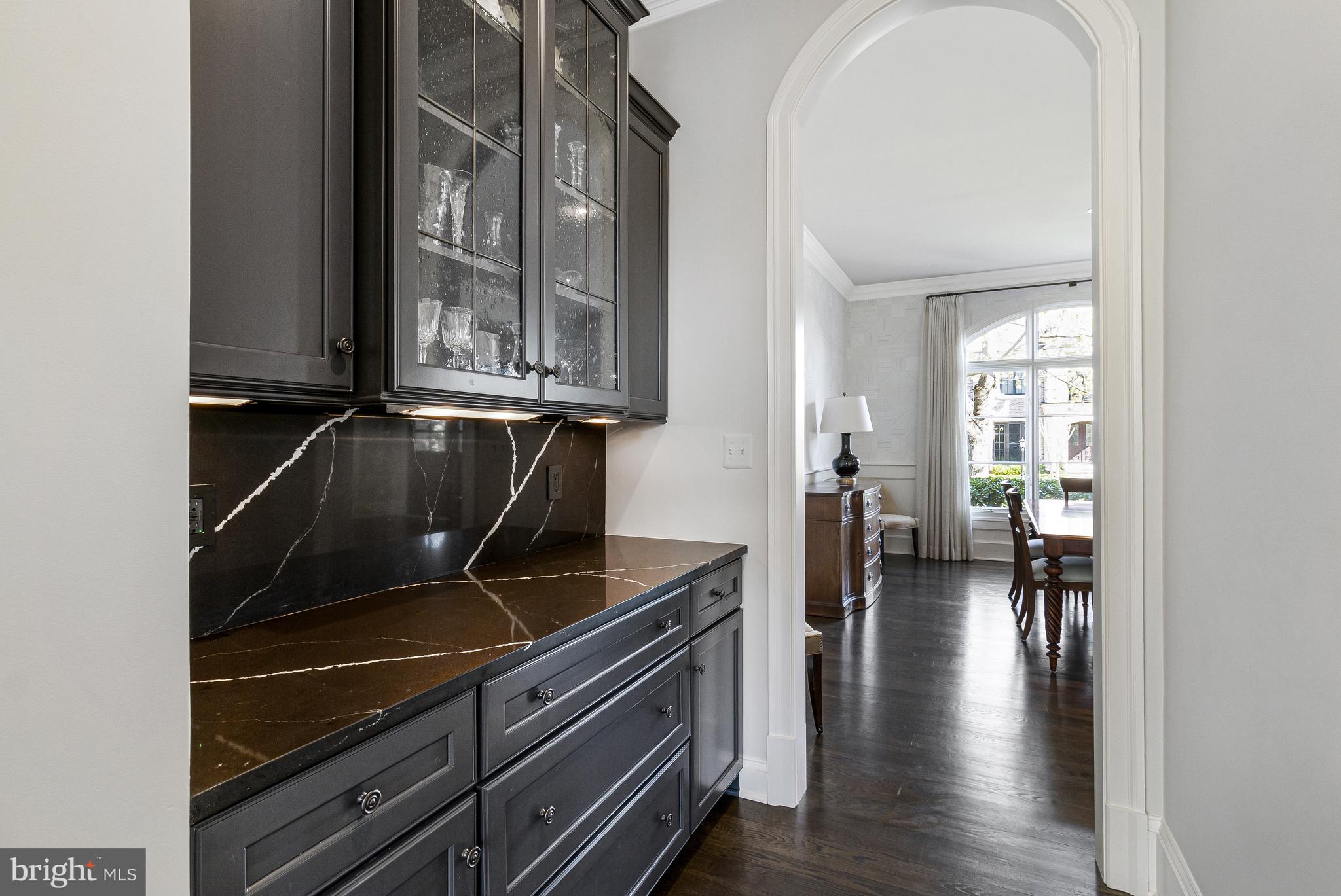 4502 32nd Road North Arlington, VA 22207 - Photo 34 of 57 a kitchen with granite countertop a stove and a wooden cabinets