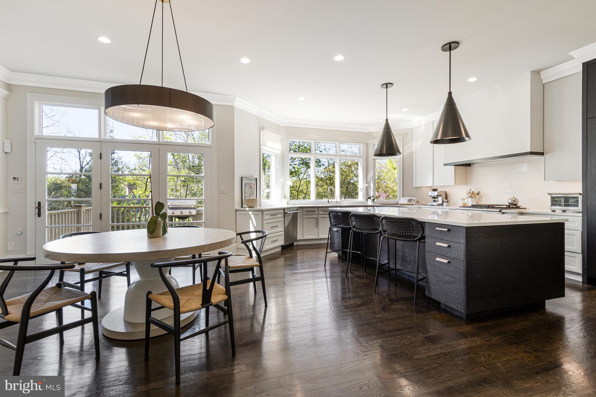 4502 32nd Road North Arlington, VA 22207 - Photo 36 of 57 a kitchen with stainless steel appliances granite countertop a sink a stove and a wooden floors