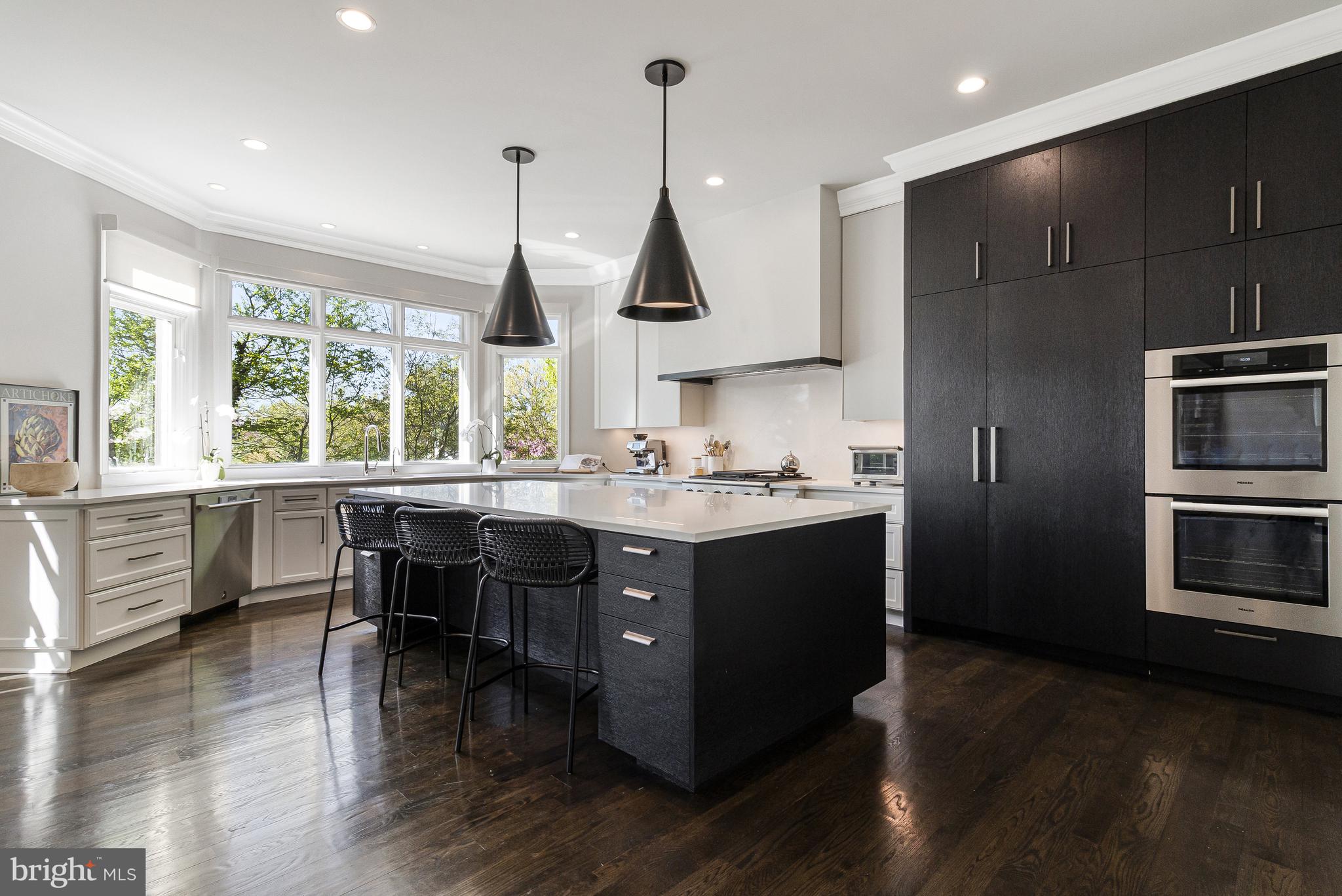 4502 32nd Road North Arlington, VA 22207 - Photo 38 of 57 a kitchen with stainless steel appliances granite countertop a sink a stove and a wooden floors
