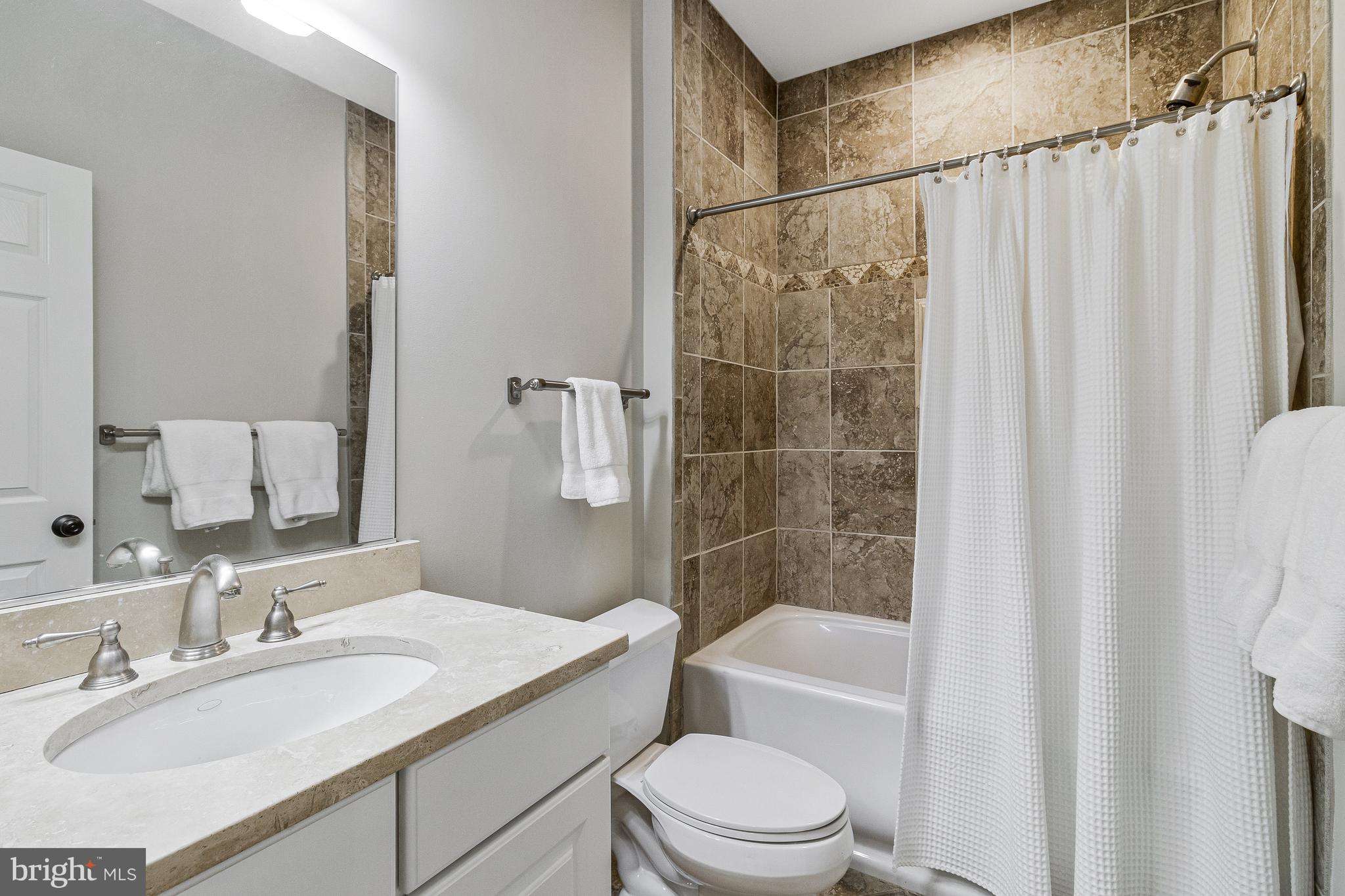 4502 32nd Road North Arlington, VA 22207 - Photo 48 of 57 a bathroom with a sink a toilet and shower