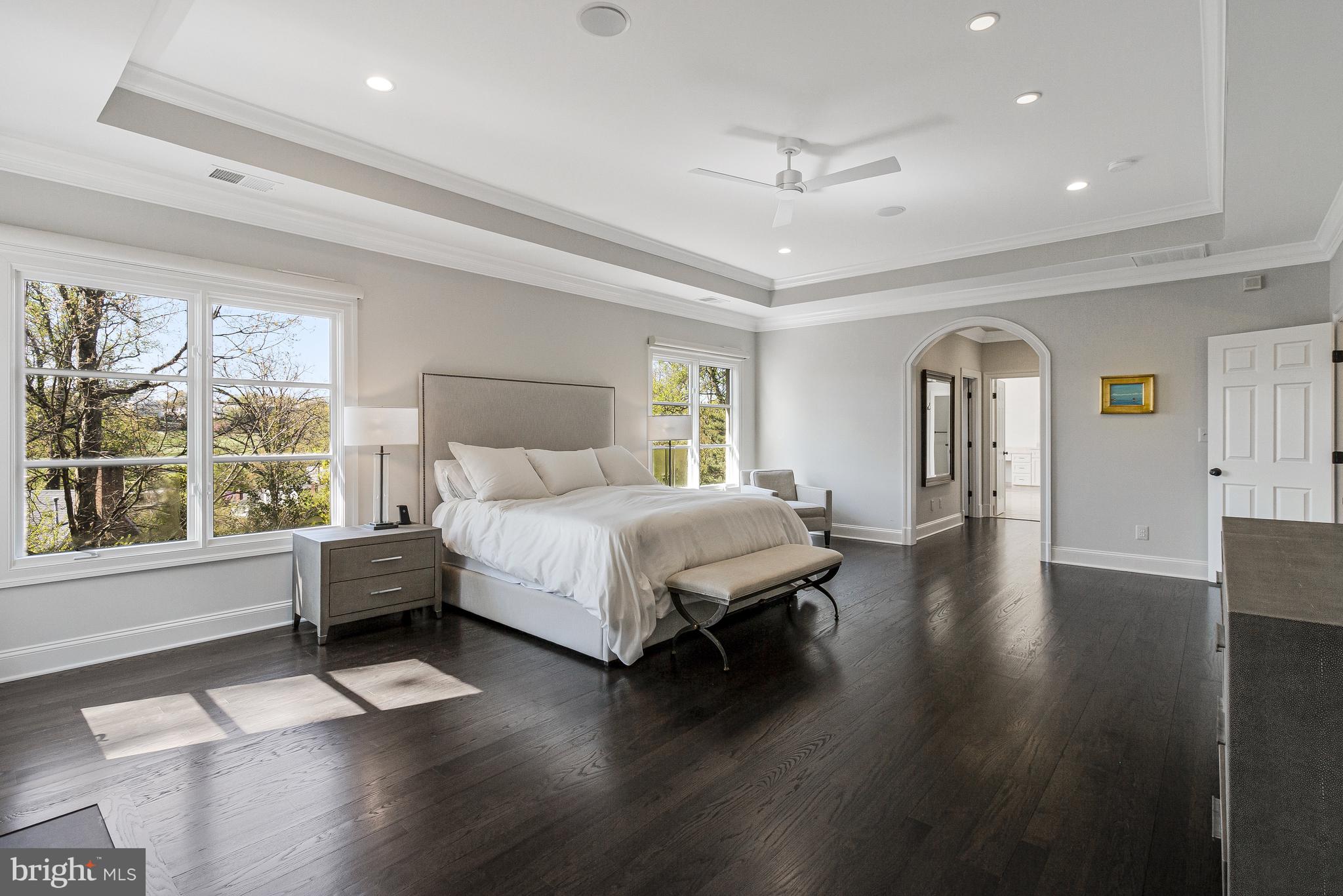 4502 32nd Road North Arlington, VA 22207 - Photo 55 of 57 a spacious bedroom with a bed and wooden floor