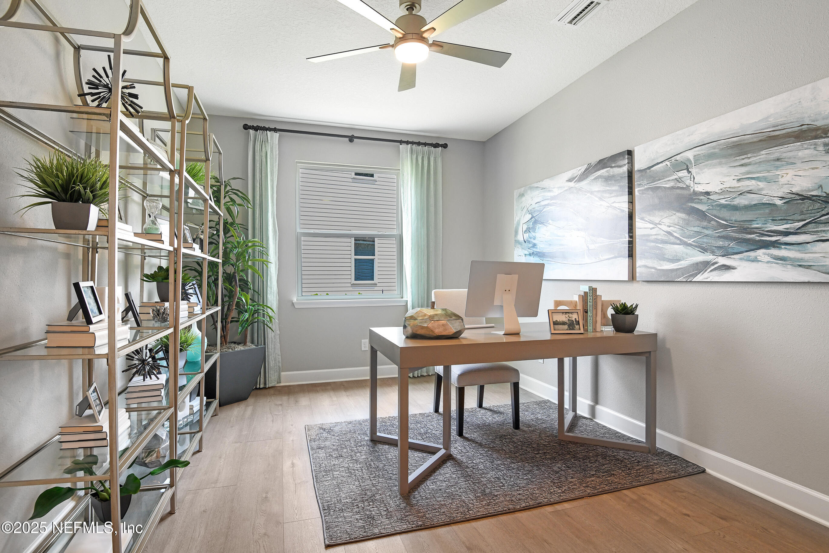 194 Enclave Avenue Palm Coast, FL 32164 - Photo 3 of 18 a workspace with furniture and a window