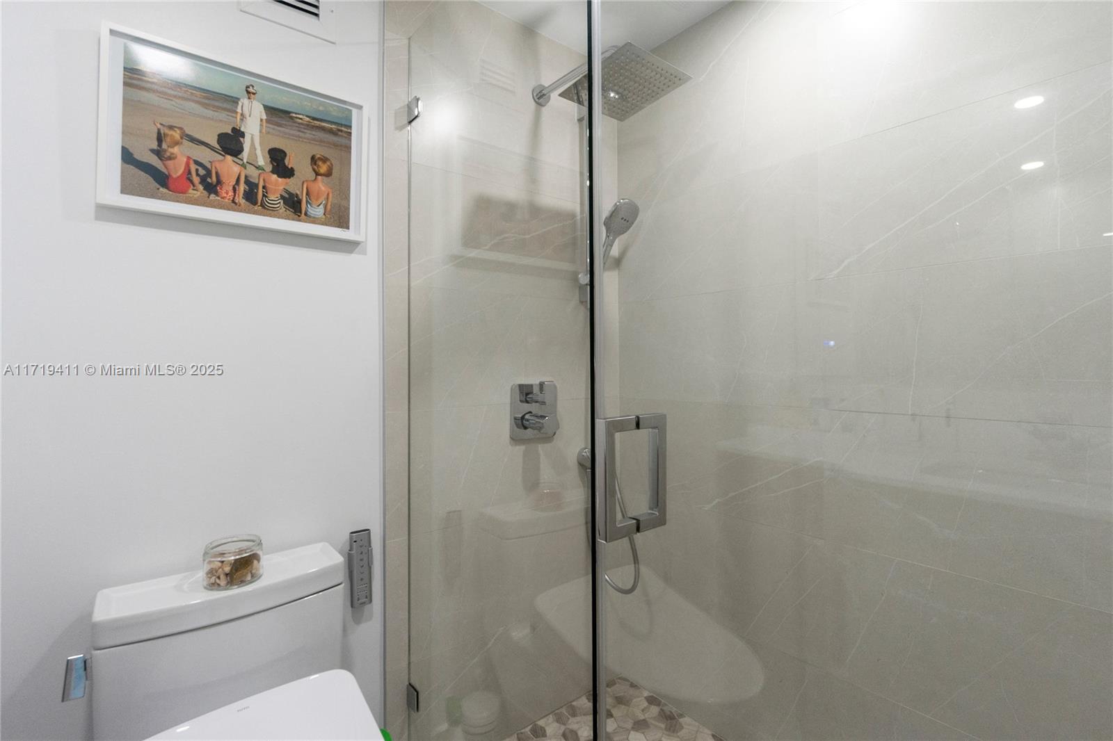 100 Lincoln Road, Unit 1411 Miami Beach, FL 33139 - Photo 11 of 36 a bathroom with a toilet and a shower