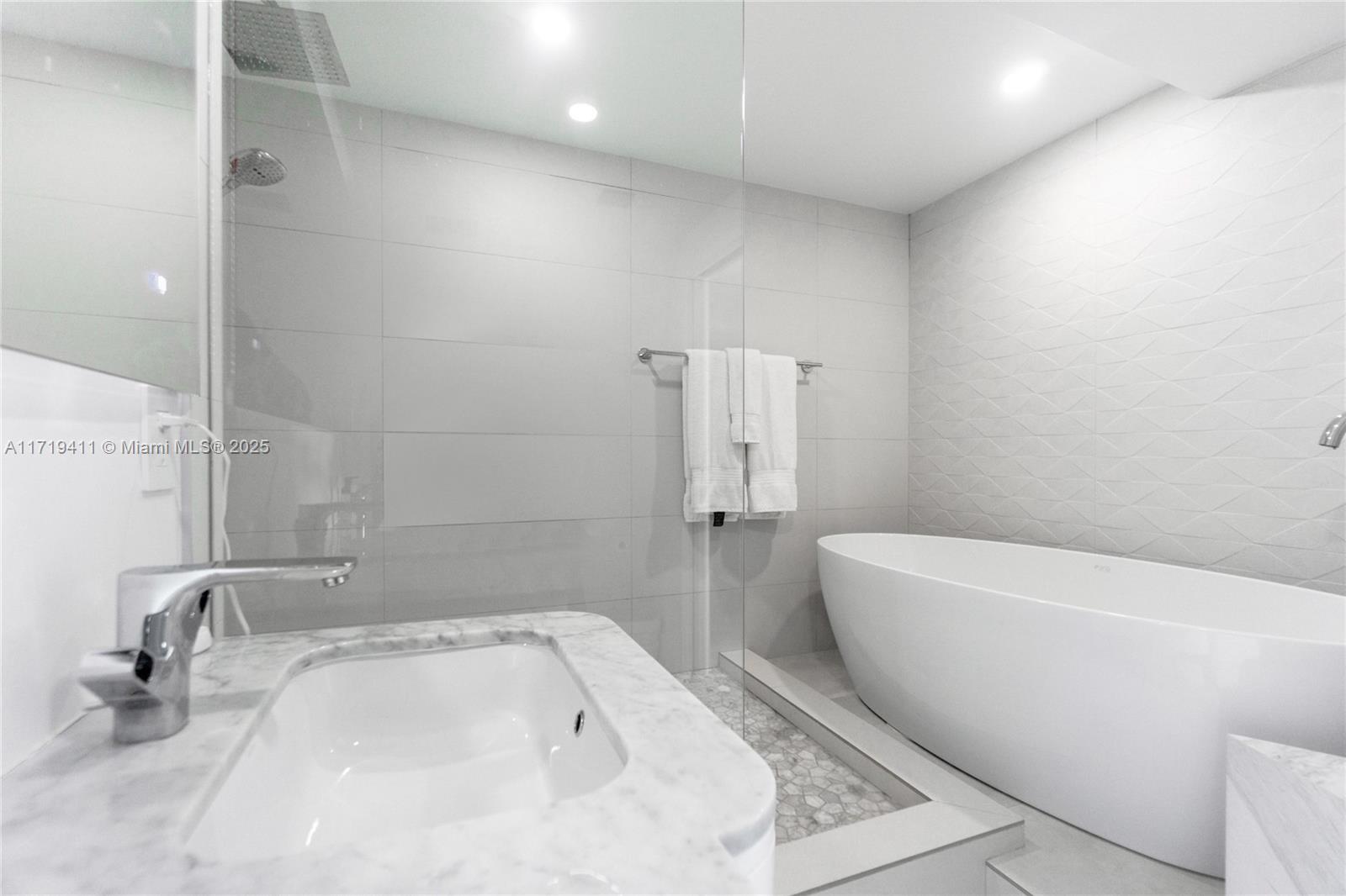 100 Lincoln Road, Unit 1411 Miami Beach, FL 33139 - Photo 19 of 36 a bathroom with a bathtub sink and toilet