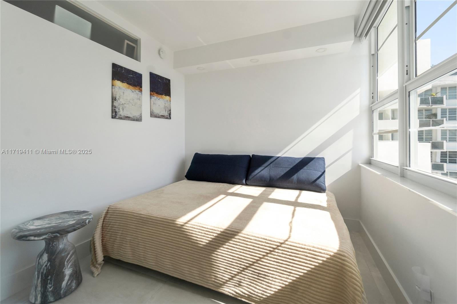 100 Lincoln Road, Unit 1411 Miami Beach, FL 33139 - Photo 8 of 36 a bedroom with a bed and a window