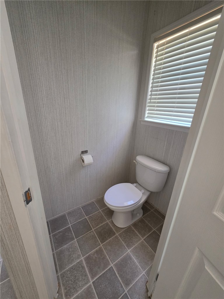 1400 Massey Road Pendleton, SC 29670 - Photo 16 of 25 This functional bathroom features practical tiling and a window for natural light.