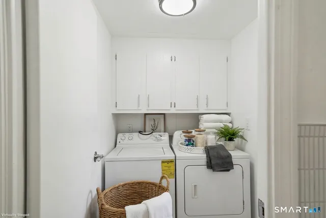 a utility room with a sink dryer and washer
