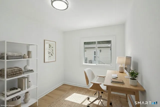 a kitchen with white cabinets and white appliances