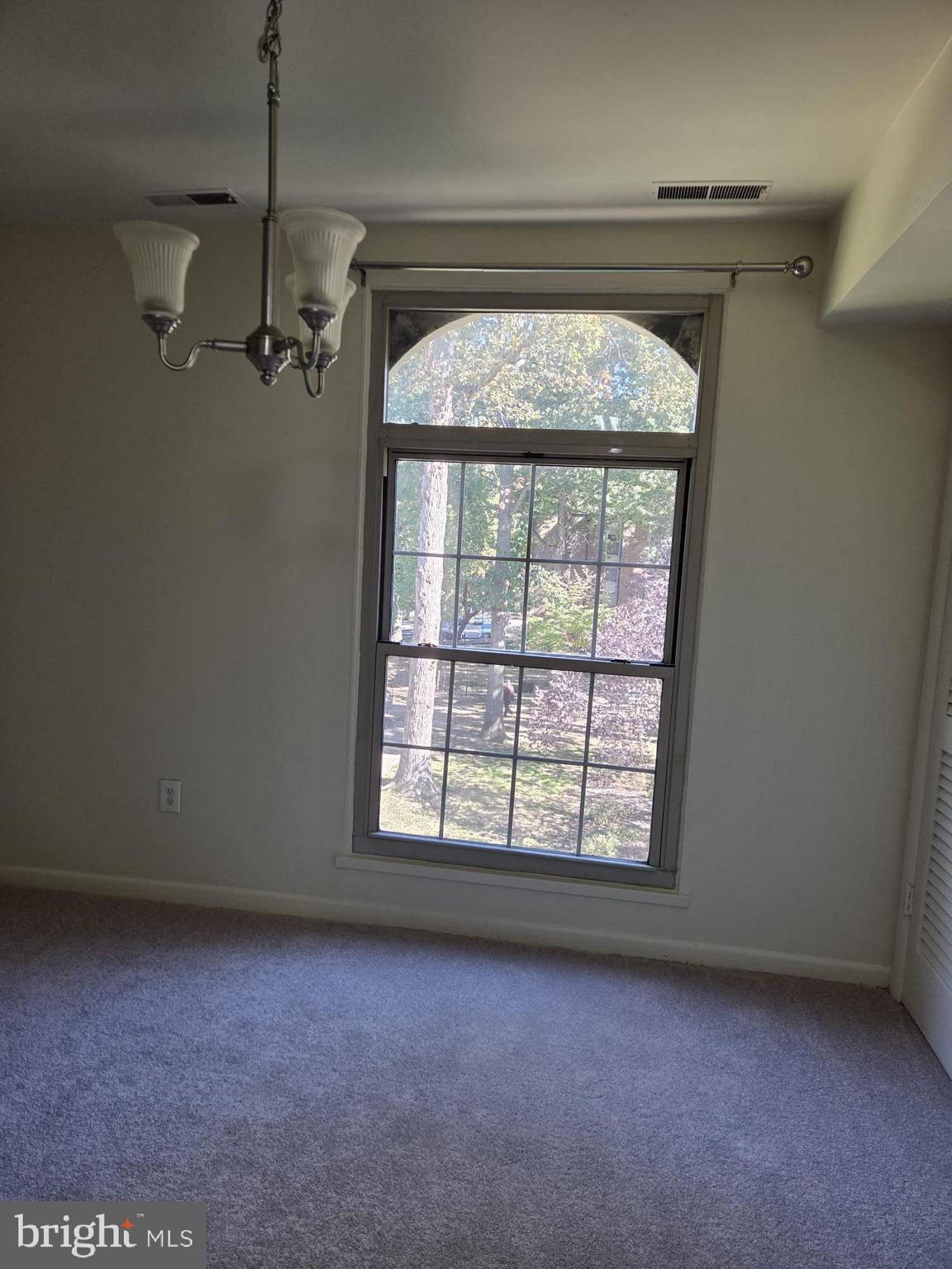 3304 Woodburn Road, Unit 31 Annandale, VA 22003 - Photo 5 of 11 an empty room with a empty space and windows