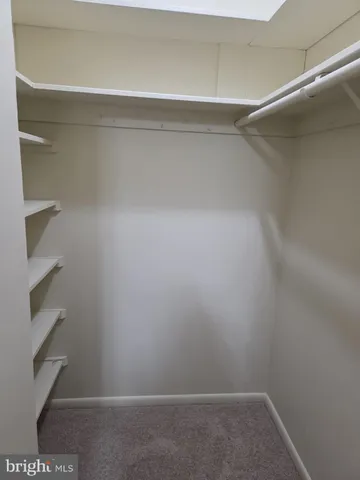 a view of an empty walk in closet