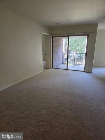 a view of empty room with front door