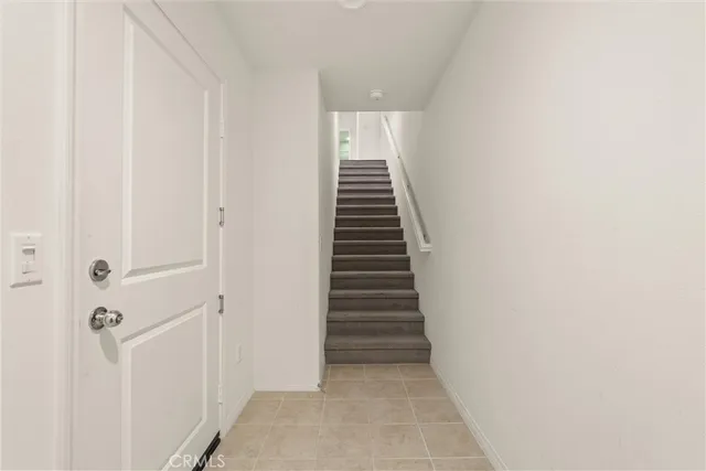 a view of a hallway with stairs