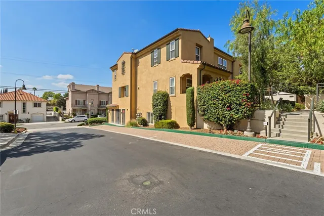 a view of a street with a building in the background
