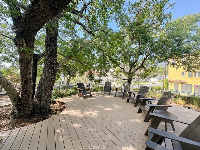 a view of a backyard with sitting area