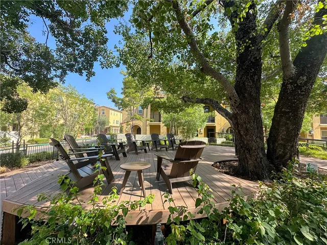 a backyard of a house with outdoor seating