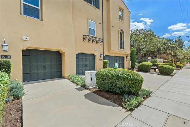a front view of a building with garden