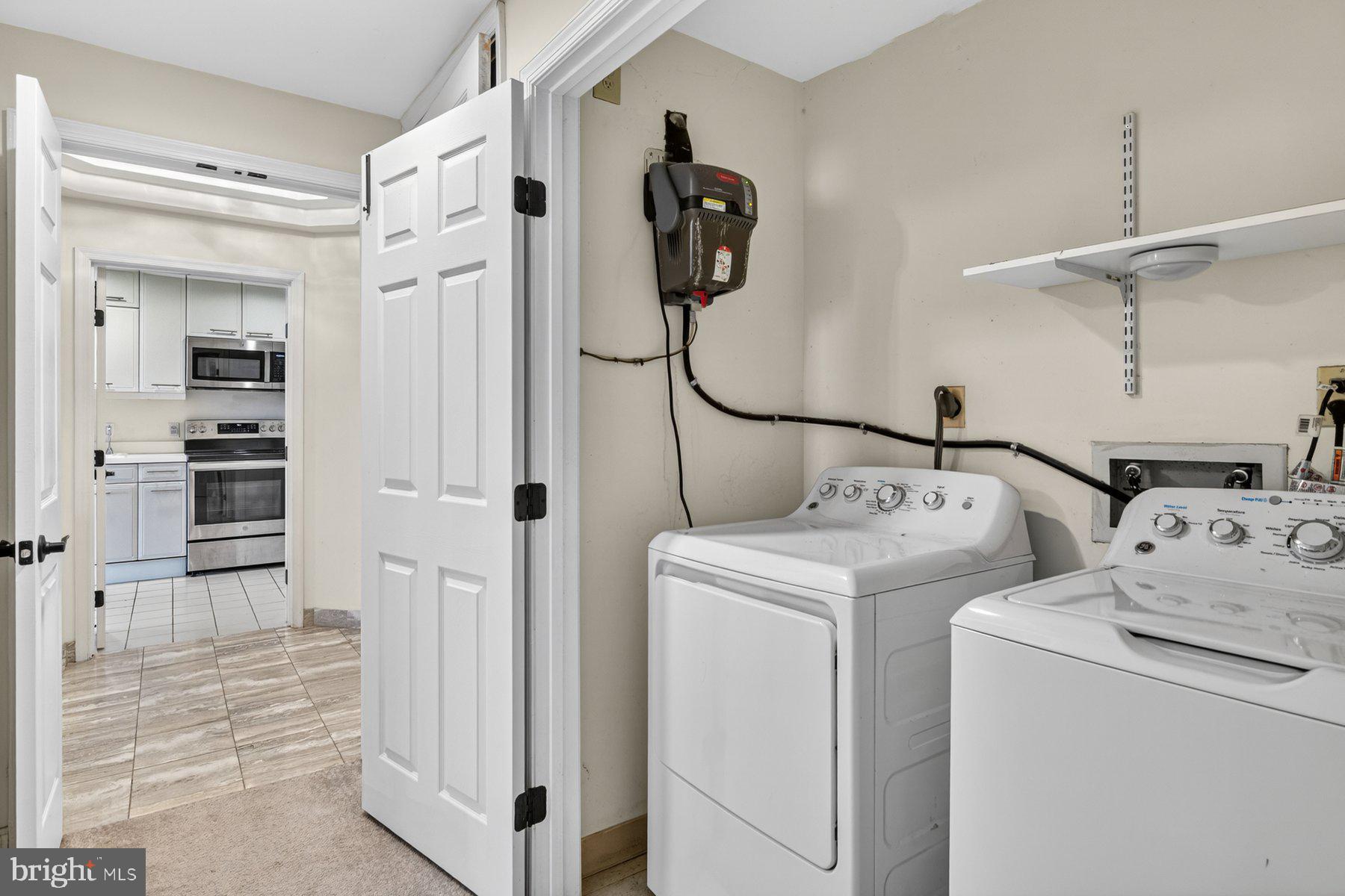 3801 Canterbury Road, Unit 403 Baltimore, MD 21218 - Photo 22 of 25 Functional laundry space with modern appliances.