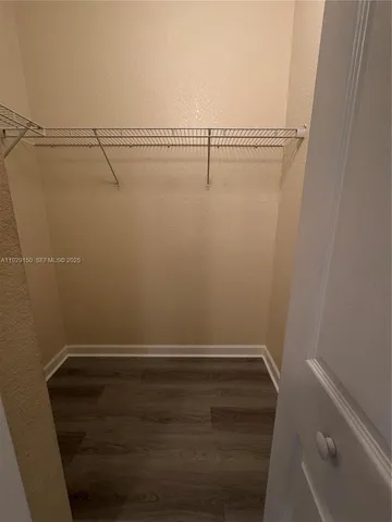 a view of a room with racks on the wall