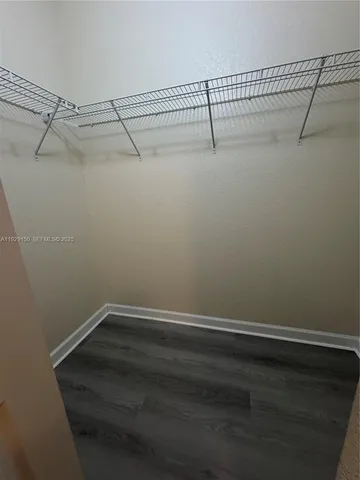 a view of a room with racks on the wall