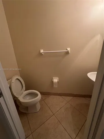 a bathroom with a sink and toilet
