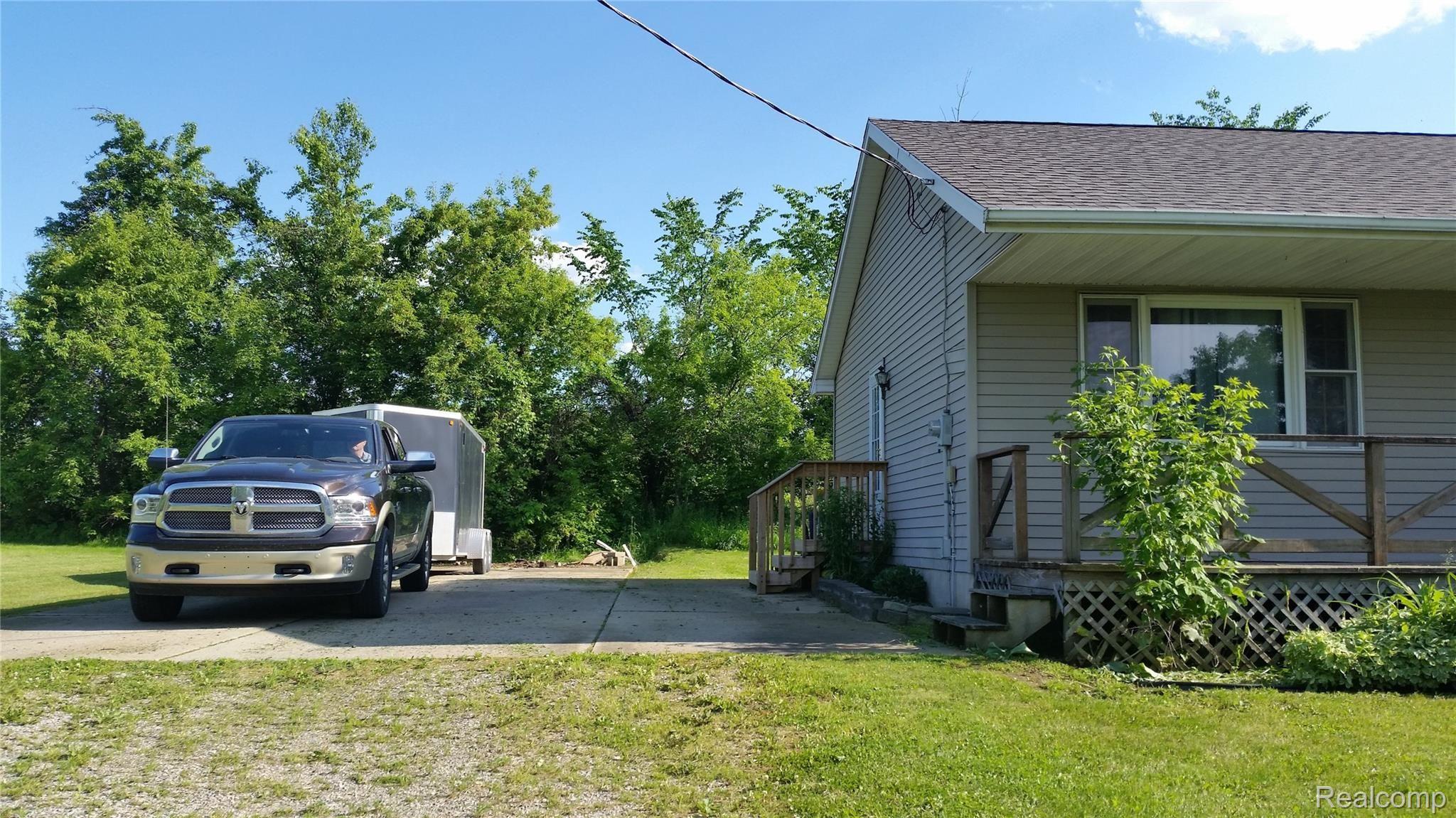 5189 Stewart Road Lapeer, MI 48446 - Photo 2 of 31 5189 stewart East side drive.jpg