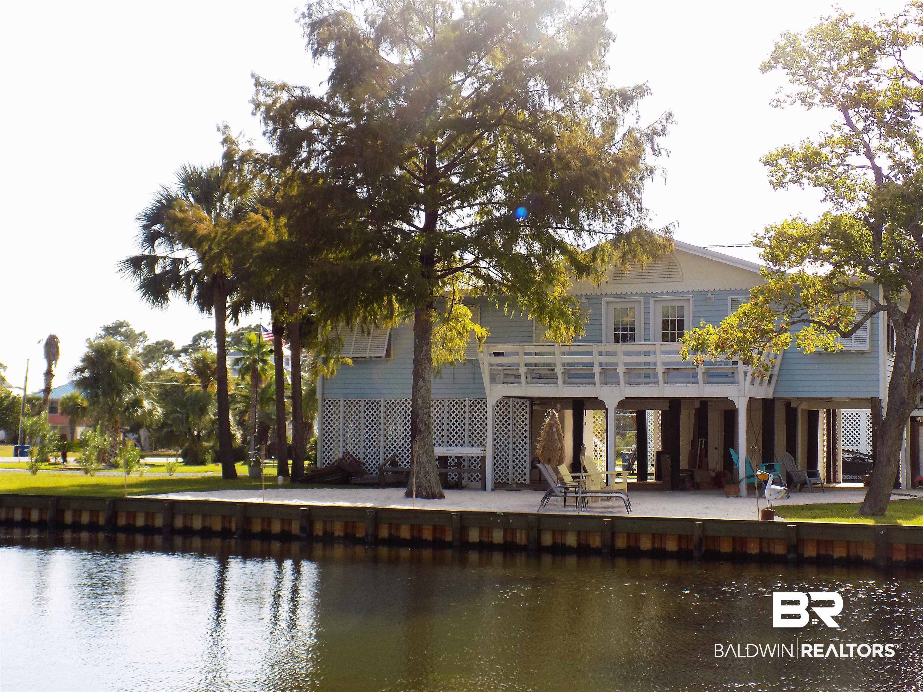 304 Windmill Ridge Road Gulf Shores, AL 36542 - Photo 1 of 29 Rear view of property featuring a patio and a water view