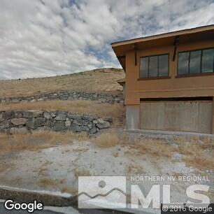 8885 Terabyte Court Reno, NV 89521 - Photo 1 of 1 a front view of a house with a yard