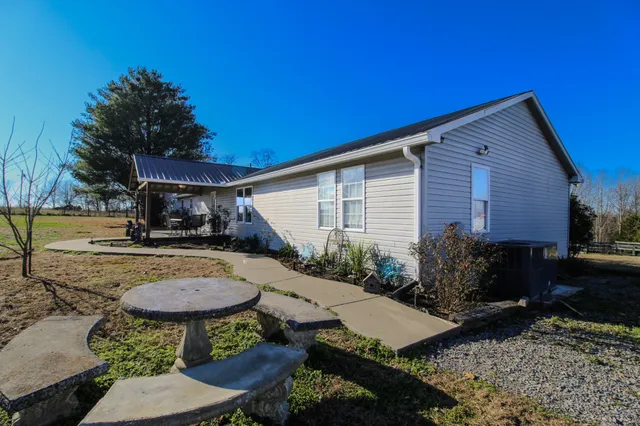 an aerial view of residential house with outdoor space