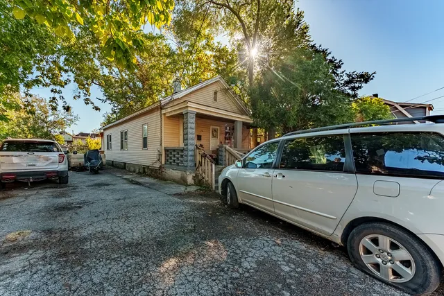 a view of a car in front of house