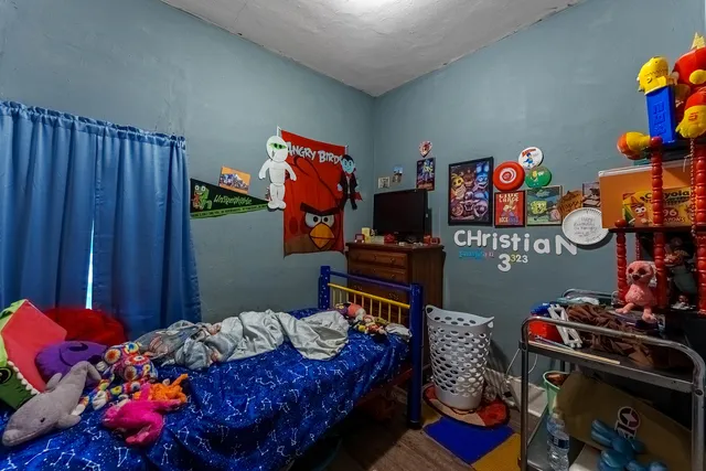 a bedroom with furniture and a bed