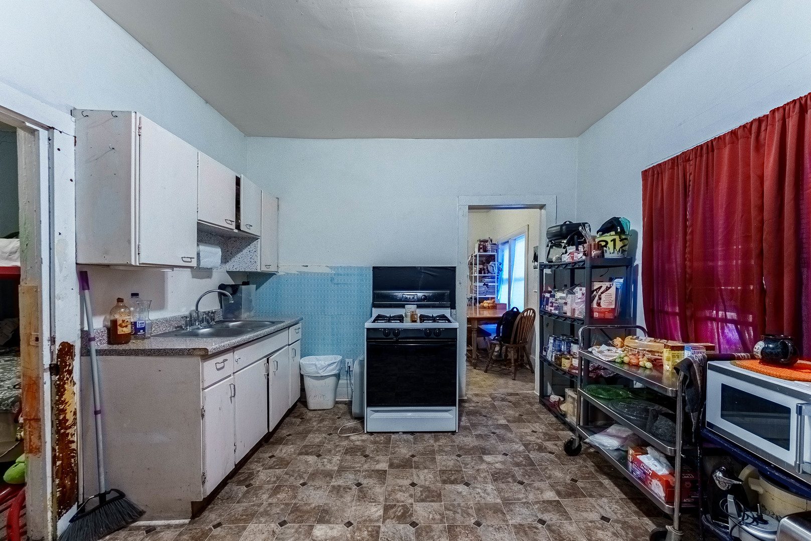 254 Mc Roberts Street Joliet, IL 60432 - Photo 7 of 15 a kitchen with stainless steel appliances granite countertop a stove refrigerator and a sink
