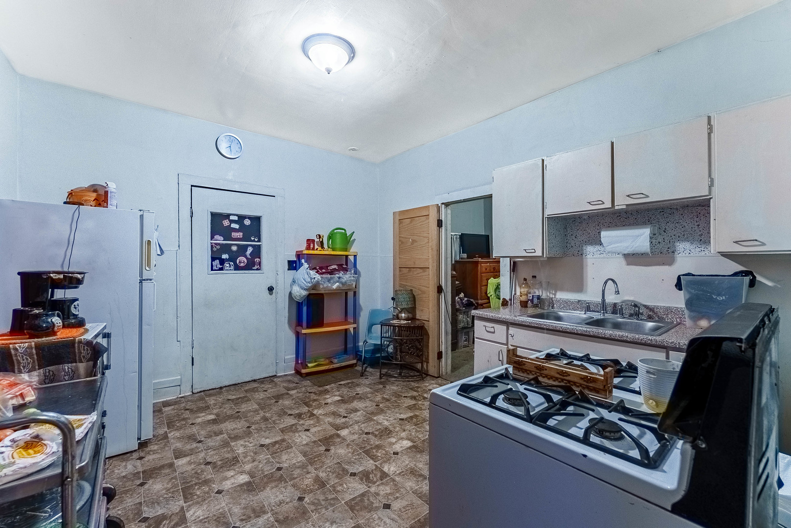 254 Mc Roberts Street Joliet, IL 60432 - Photo 8 of 15 a kitchen with stainless steel appliances granite countertop a stove and a refrigerator