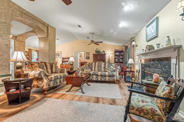 a living room with furniture and a fireplace