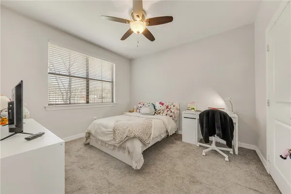 a bathroom with a sink vanity mirror and toilet