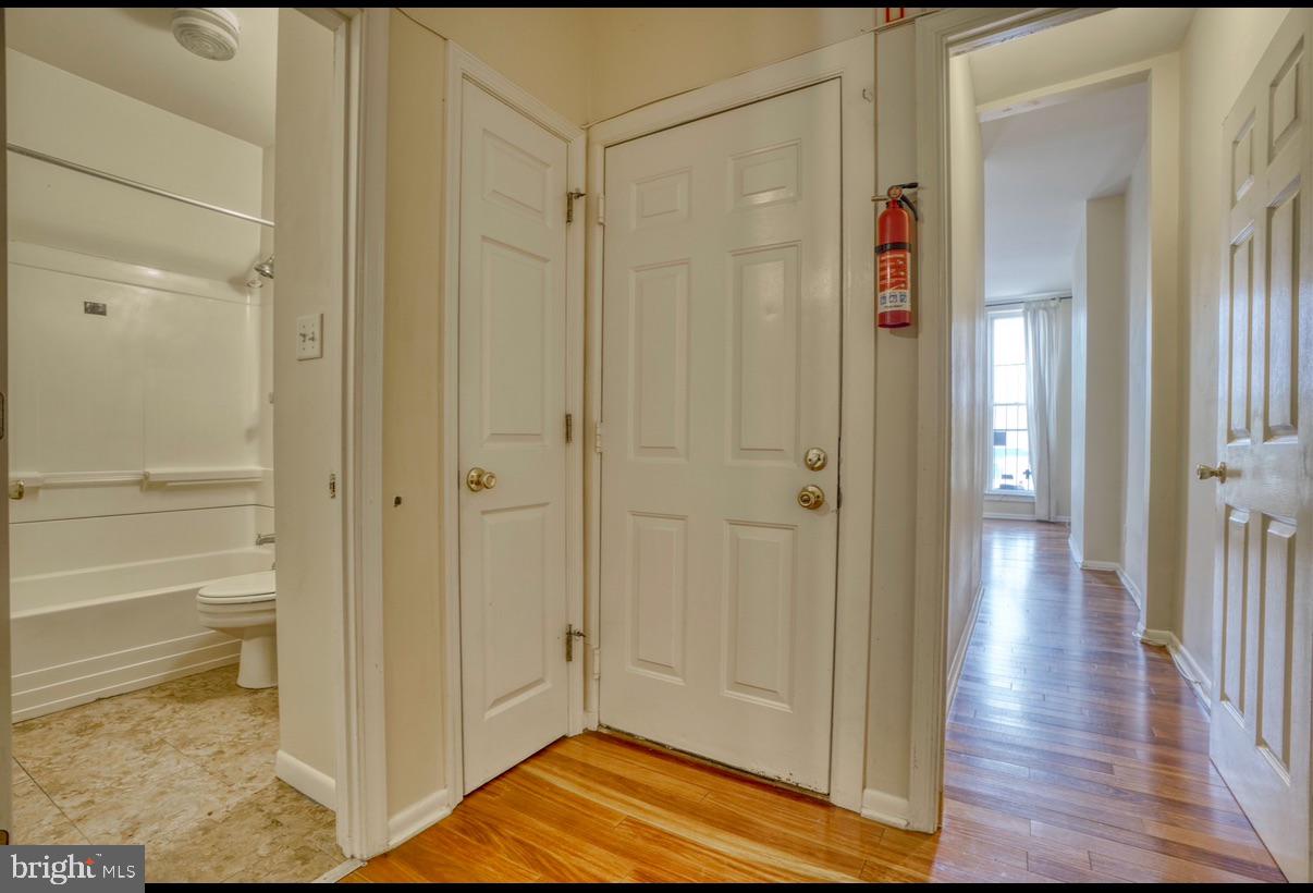 424 East North Avenue Baltimore, MD 21202 - Photo 9 of 10 a view of a hallway with wooden floor and closet area