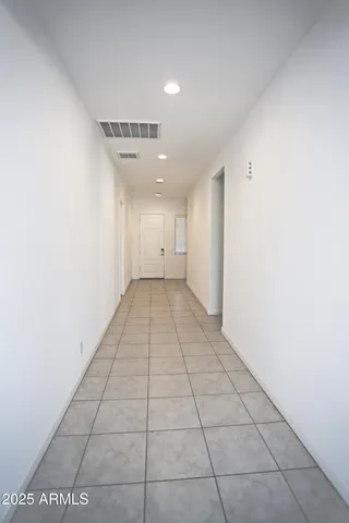 a view of kitchen with stainless steel appliances a sink and cabinets
