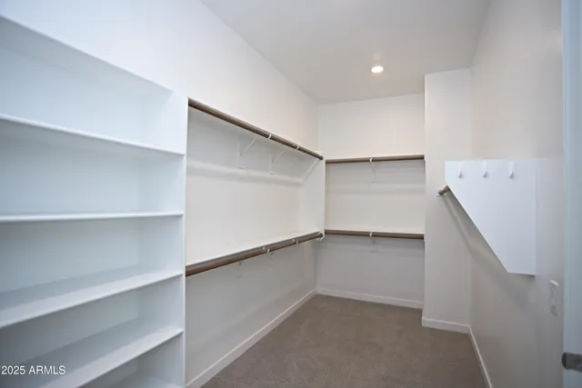 a view of kitchen with stainless steel appliances granite countertop a refrigerator sink and cabinets