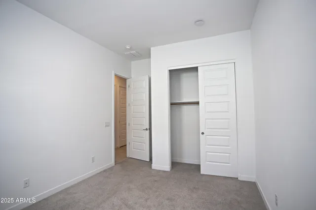 a bathroom with a granite countertop sink a shower and a mirror