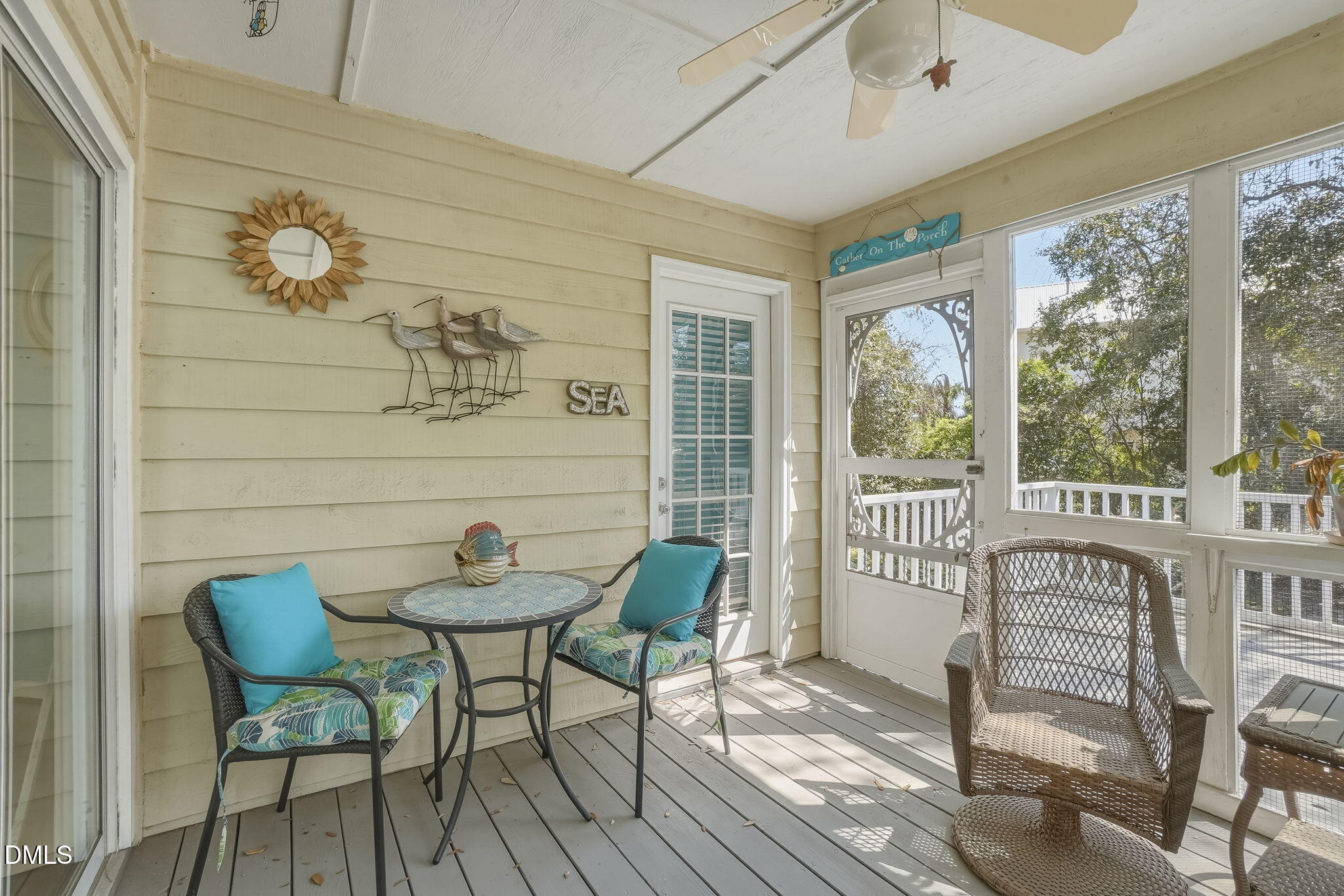 805 Sloop Pointe Lane Kure Beach, NC 28449 - Photo 12 of 20 a view of a dining room with furniture window and outside view