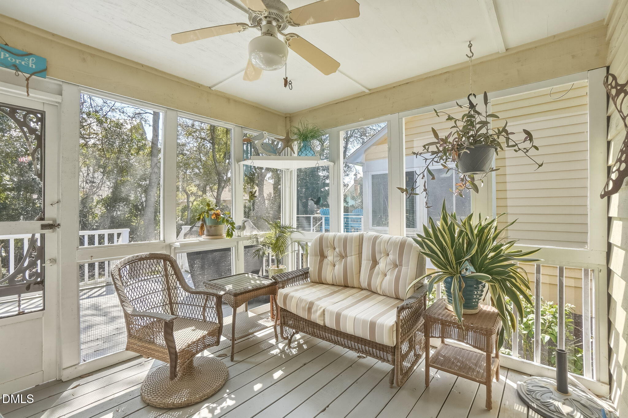 805 Sloop Pointe Lane Kure Beach, NC 28449 - Photo 13 of 20 a living room with furniture and a large window
