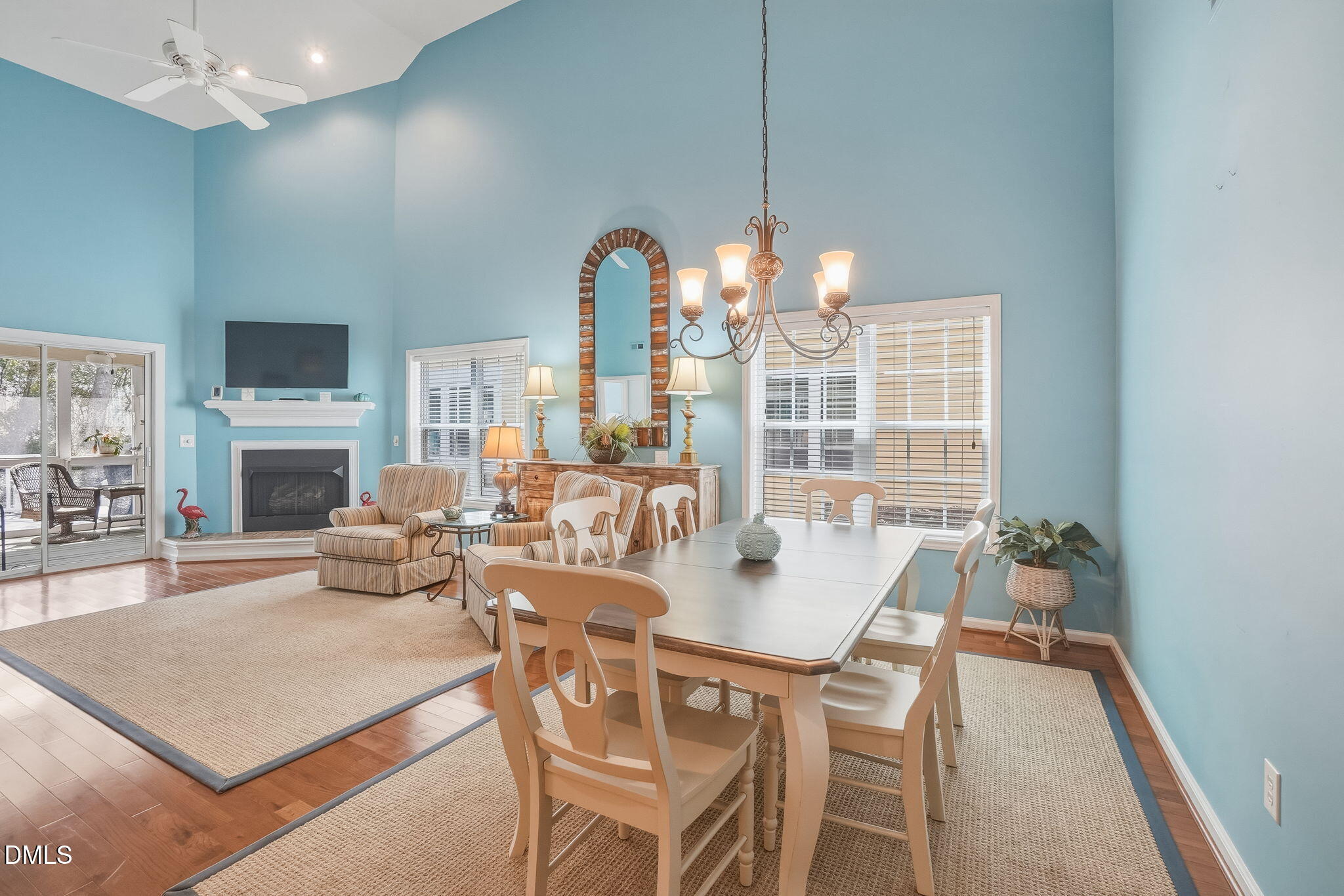 805 Sloop Pointe Lane Kure Beach, NC 28449 - Photo 4 of 20 a view of a dining room with furniture a chandelier and wooden floor